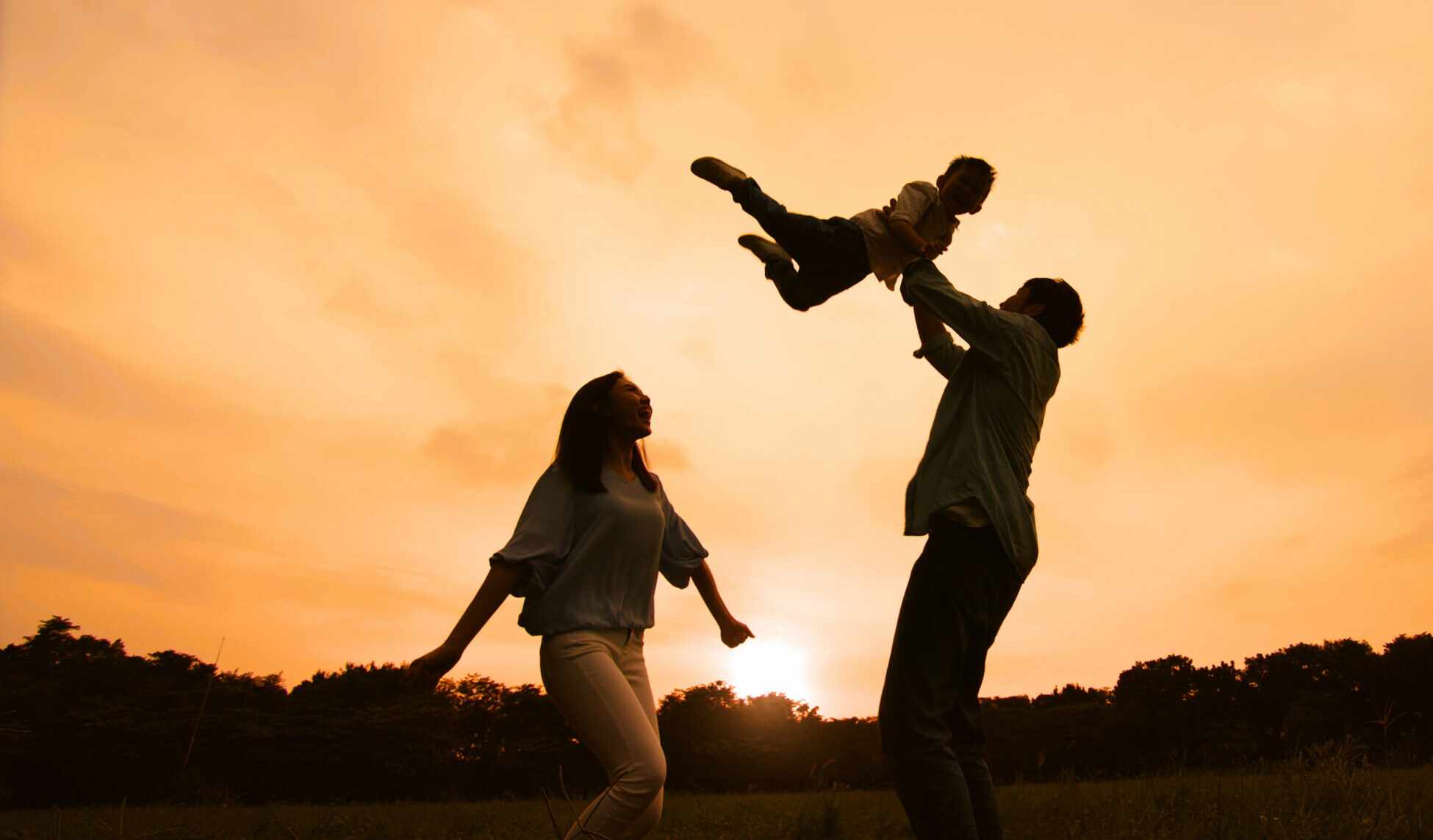 silhouette of parent play with kid outdoor