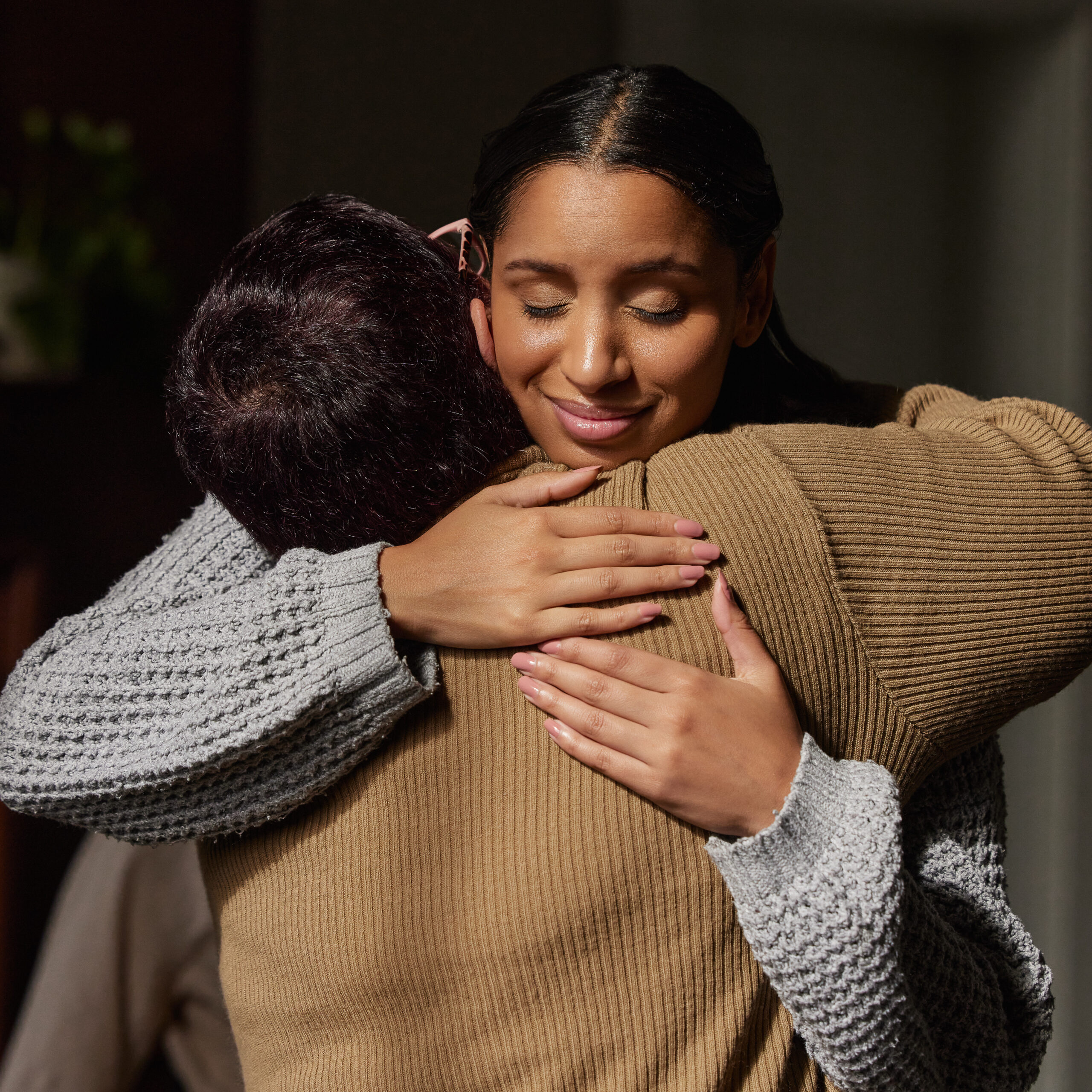 Person talking to their significant other and hugging