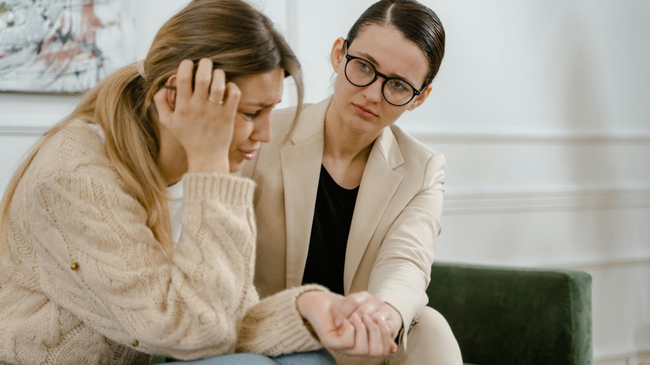 Shot of a woman in therapy. Learn the signs you need therapy today.