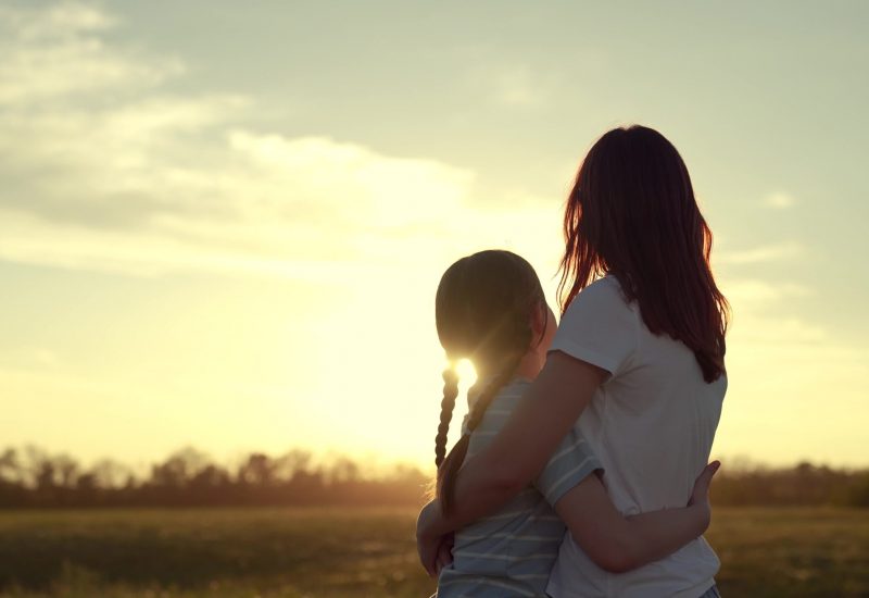 mother daughter happy family, woman kid happy family hugging, Mother Daughter Embracing Sunset, Serene Evening Countryside, Warm Hug Nature Glow, Family Love Under Twilight Sky, Peaceful, Moment Fields, Togetherness Sundown, Tender Affection Golden Light, Watching Sun Dip Below Horizon, Quiet Bond Open Air
