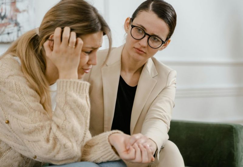 Shot of a woman in therapy. Learn the signs you need therapy today.